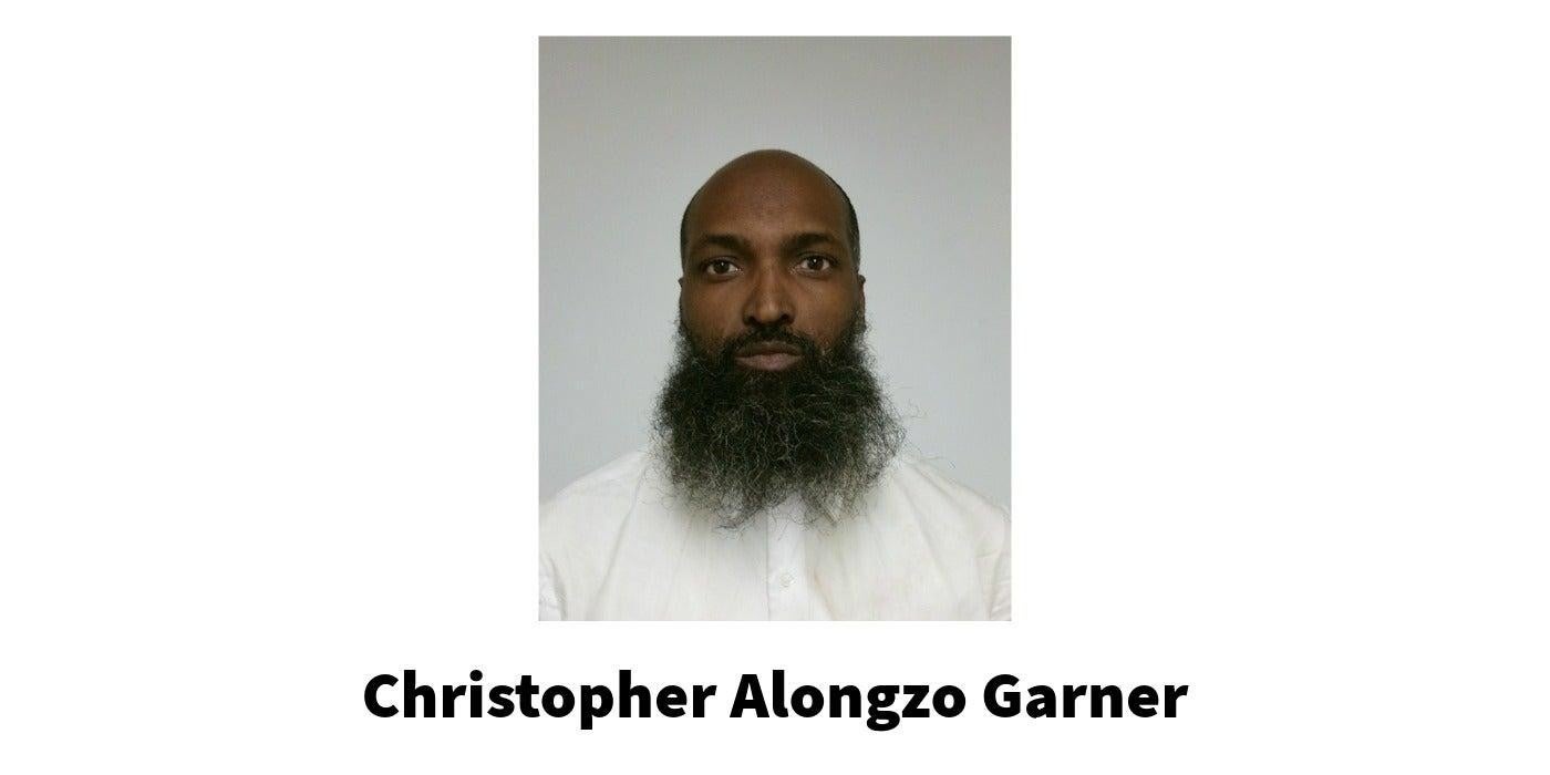 A man wearing a white shirt. Christopher Alongzo Garner.