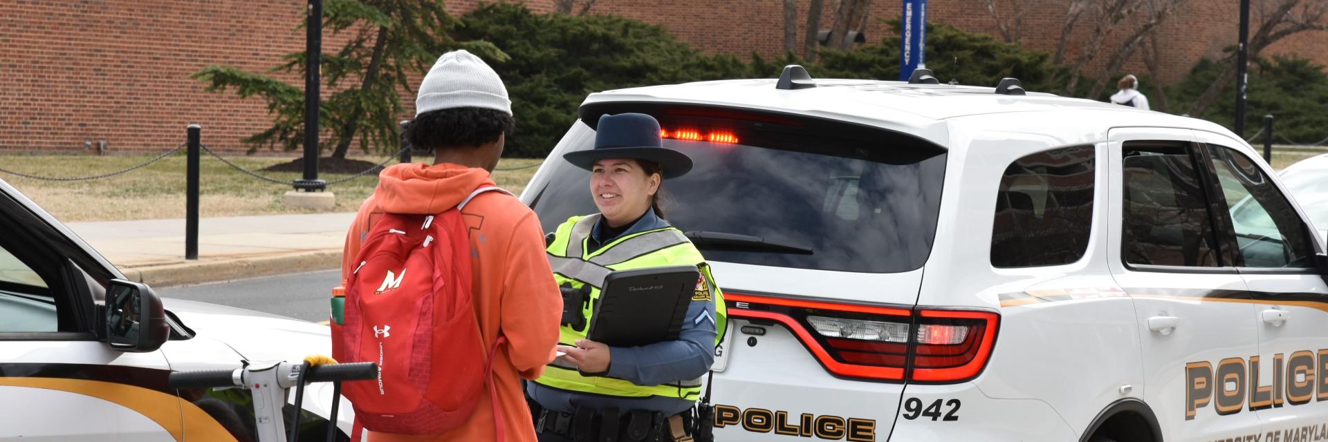 UMPD Police officer helping student